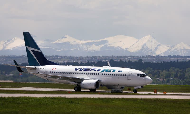 FILE PHOTO: Westjet airline plane lands at the Calgary International Airport in Calgary