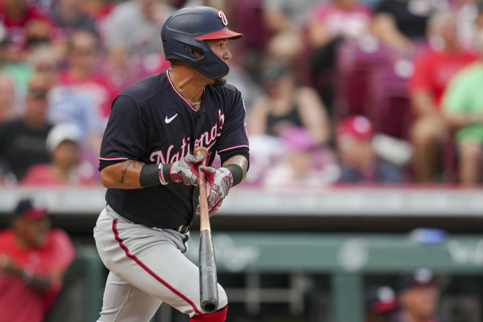 Washington Nationals' Ildemaro Vargas watches his RBI double during the ninth inning of a baseball game against the Cincinnati Reds in Cincinnati, Saturday, Aug. 5, 2022. (AP Photo/Aaron Doster)