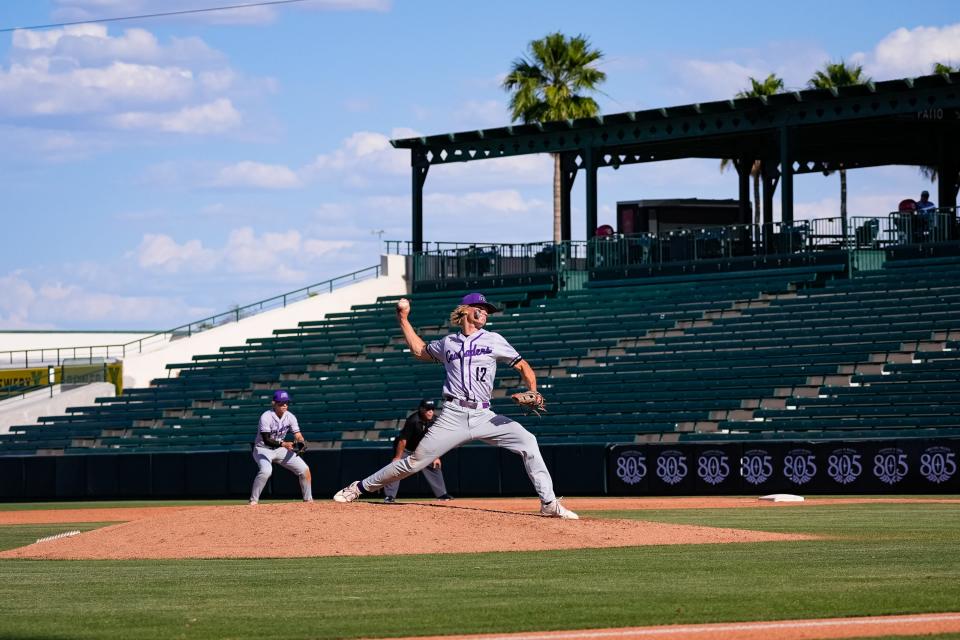 Gunnar Penzkover (12) of Northwest Christian pitches against Valley Christian in the 3A Baseball State Championship at Tempe Diablo Stadium on May 15, 2023 in Tempe, AZ.
