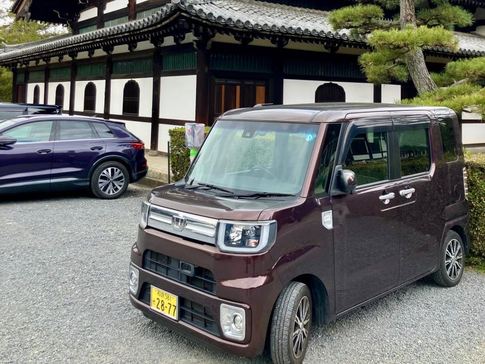 A Honda N-Box kei car is parked at the site of the Tofukuji Temple in Kyoto, Japan