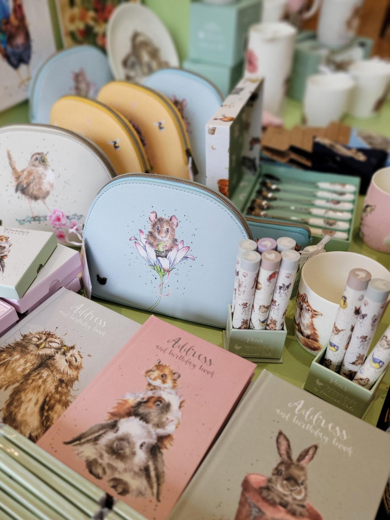 At Bumble's Dry Goods in Chelsea, Owner Carolyn McNagny curates a variety of products to sell at the store, including pens and mugs with animals on them.