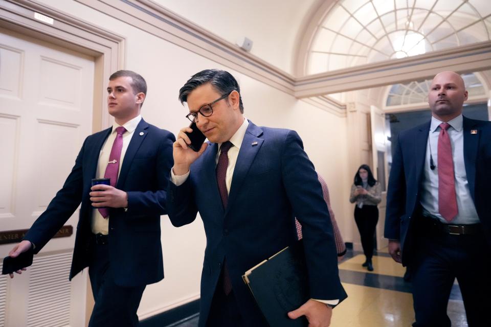 Speaker of the House Mike Johnson, R-La., leaves a caucus meeting ahead of a vote to expel Rep. George Santos, R-N.Y., from the House of Representatives on December 01, 2023 in Washington, DC.