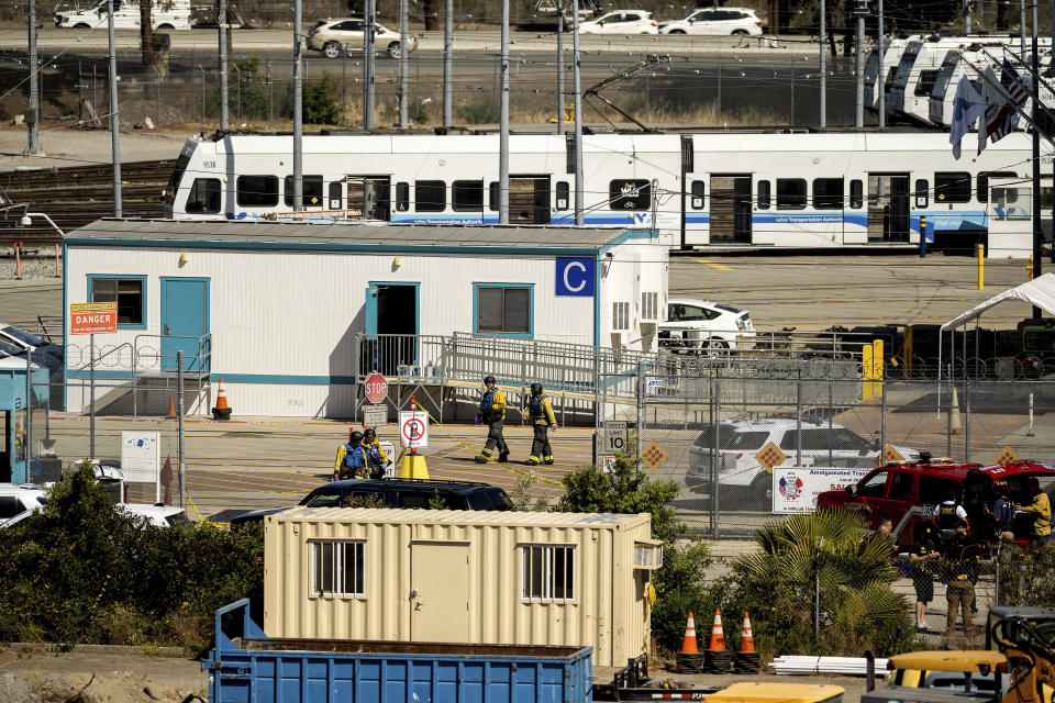 Emergency personnel respond to a shooting at a Santa Clara Valley Transportation Authority (VTA) facility on Wednesday, May 26, 2021, in San Jose, Calif. Santa Clara County sheriff's spokesman said the rail yard shooting left multiple people, including the shooter, dead. (AP Photo/Noah Berger)
