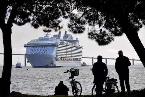 The brand new Symphony sailing into France’s Saint-Nazaire shipyard - Credit: Royal Caribbean