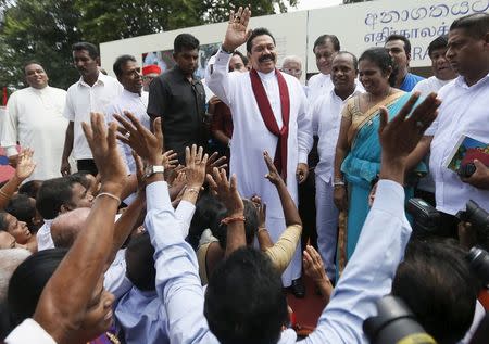 Sri Lanka's former president Mahinda Rajapaksa, who is contesting in the upcoming general election, waves at his supporters during the launch ceremony of his manifesto, in Colombo July 28, 2015. REUTERS/Dinuka Liyanawatte