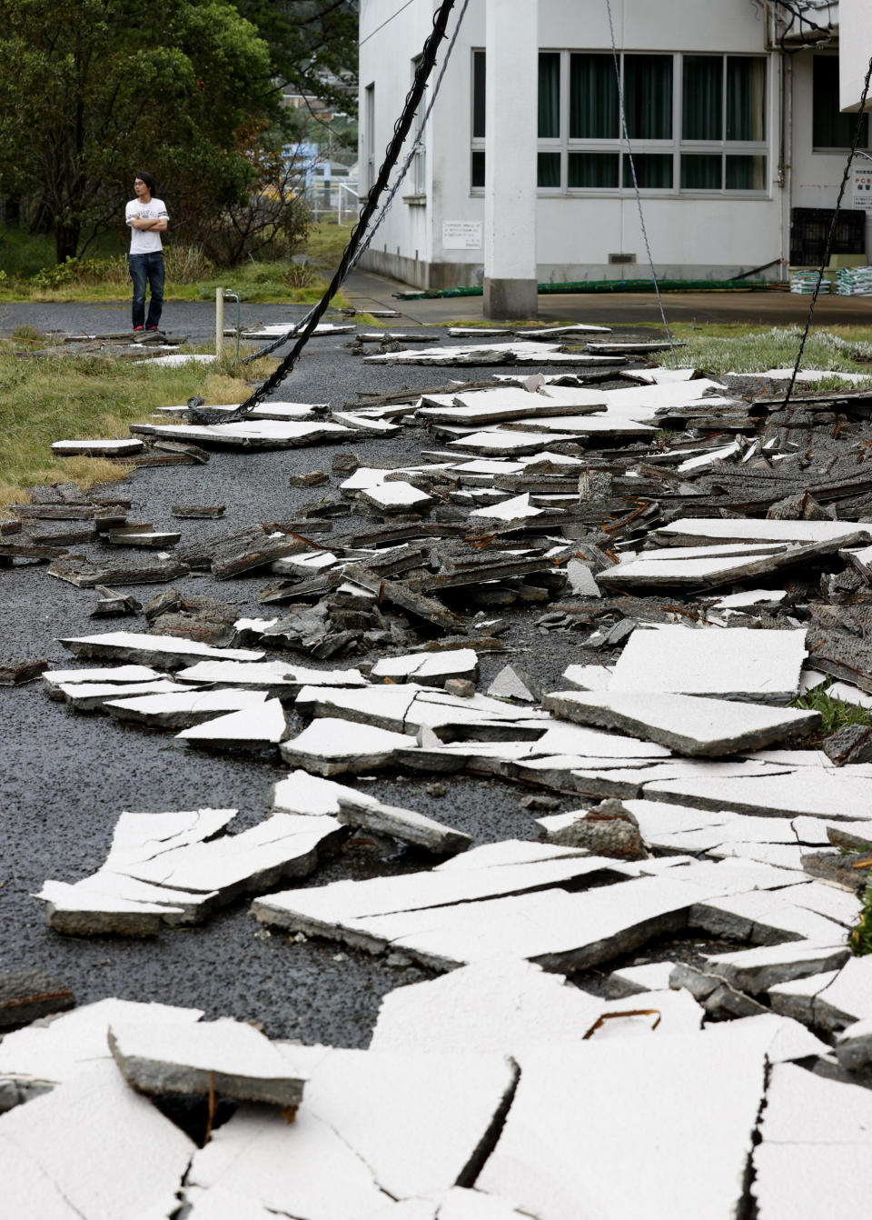 The outer walls of a gymnasium are scattered outside following a typhoon in Nagasaki, southwestern Japan Monday, Sept. 7, 2020. The second powerful typhoon to slam Japan in a week left people injured, damaged buildings, caused blackouts at nearly half a million homes and paralyzed traffic in southern Japanese islands before headed to South Korea.(Kyodo News via AP)