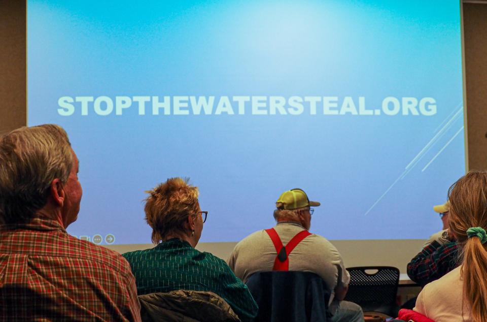 People gather at the Stop the Water Steal group's first meeting in the West Lafayette Library to write letters to their local representatives, on Wednesday, Nov. 1, 2023, in West Lafayette, Ind.
