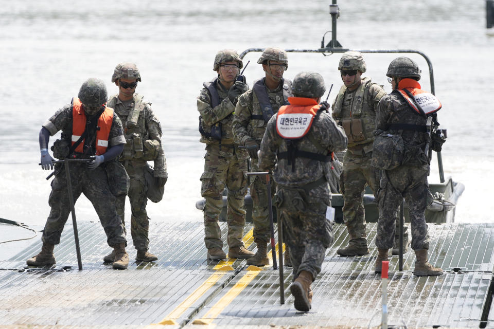 U.S. and South Korean soldiers try to connect a floating bridge during the combined wet gap crossing military drill between South Korea and the United States as a part of the Ulchi Freedom Shield military exercise in Cheorwon, South Korea, Thursday, Aug. 31, 2023. (AP Photo/Lee Jin-man)