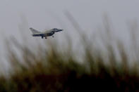 <p>A Typhoon aircraft prepares for landing at British Royal Air Forces base in Akrotiri, near costal city of Limassol in the eastern Mediterranean island of Cyprus, early Saturday, April 14, 2018. (Photo: Petros Karadjias/AP) </p>