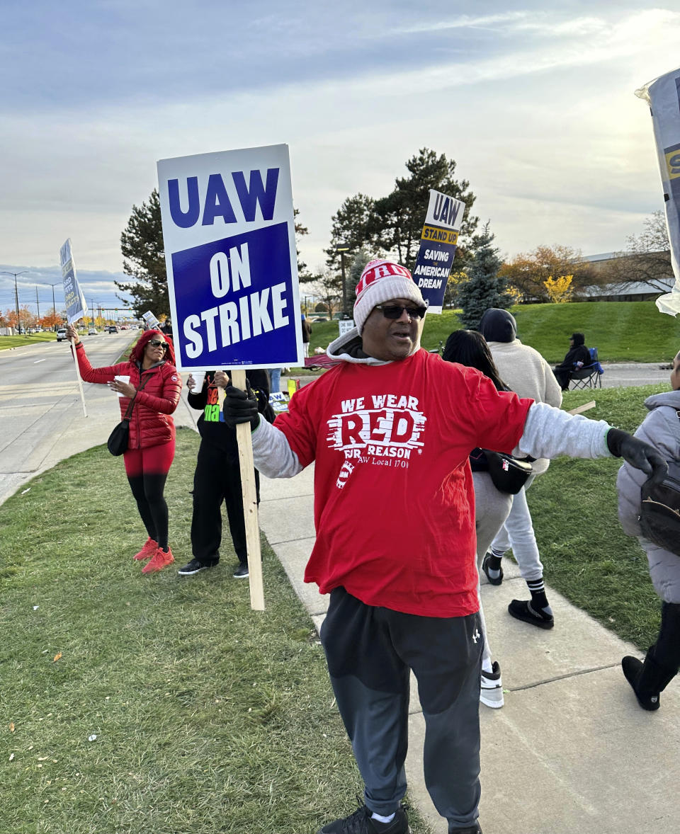 Stellantis employee and United Auto Workers member Anthony Collier reacts to news Saturday, Oct. 28, 2023, in Sterling Heights, Mich., that the UAW and the automaker have reached a tentative contract agreement. "The tentative agreement is excellent, said Collier, 54, of Sterling Heights. "We hear that it's going to be parity, at least, with Ford, so we believe a lot of people are looking forward to signing. Most of us had to dip into savings, get loans. Everybody knows the economy went up on all of us, so it's a little tight to be out on strike pay." (AP Photo/Corey Williams)