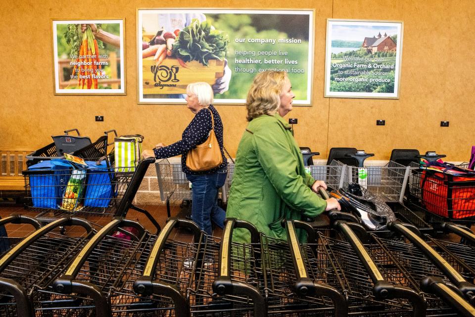 Early morning shoppers attend the grand opening of Delaware's first Wegmans at Barley Mill Plaza in Greenville, Wednesday, Oct. 26, 2022.