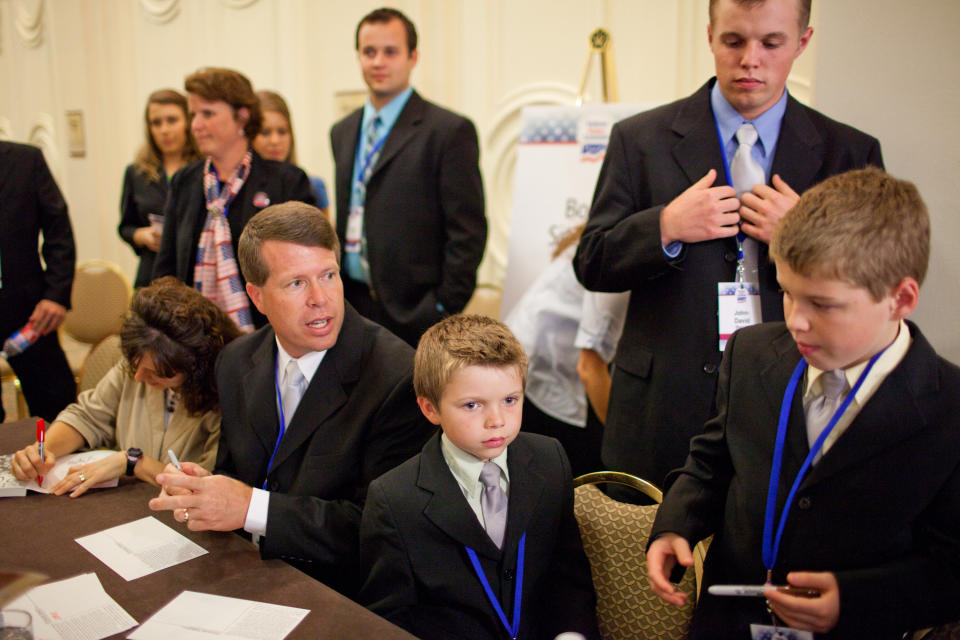 WASHINGTON - SEPTEMBER 17: Michelle Duggar and Jim Bob Duggar, stars of The Learning Channel TV show '19 Kids and Counting,' pose for a picture with a fan while signing copies of their book at the Values Voter Summit on September 17, 2010 in Washington, DC. The annual summit drew nearly two thousand people to advocate for conservative causes. (Photo by Brendan Hoffman/Getty Images)