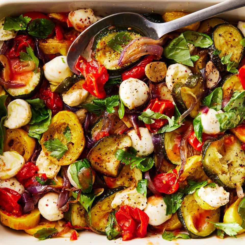 mixed summer vegetable ragú in a white pan