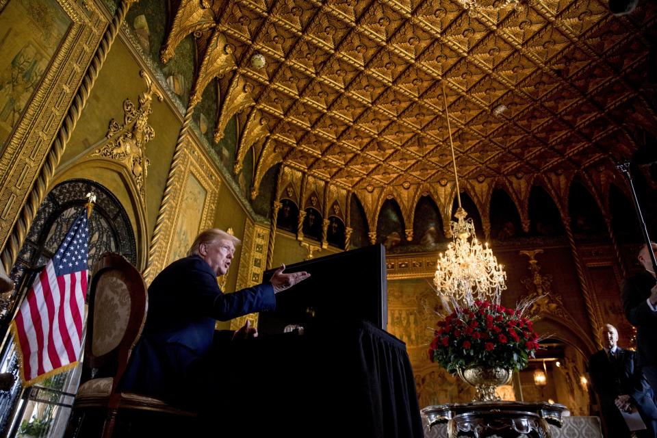 FILE - President Donald Trump speaks to members of the media following a Christmas Eve video teleconference with members of the military at his Mar-a-Lago estate in Palm Beach, Fla., Tuesday, Dec. 24, 2019. (AP Photo/Andrew Harnik, File)