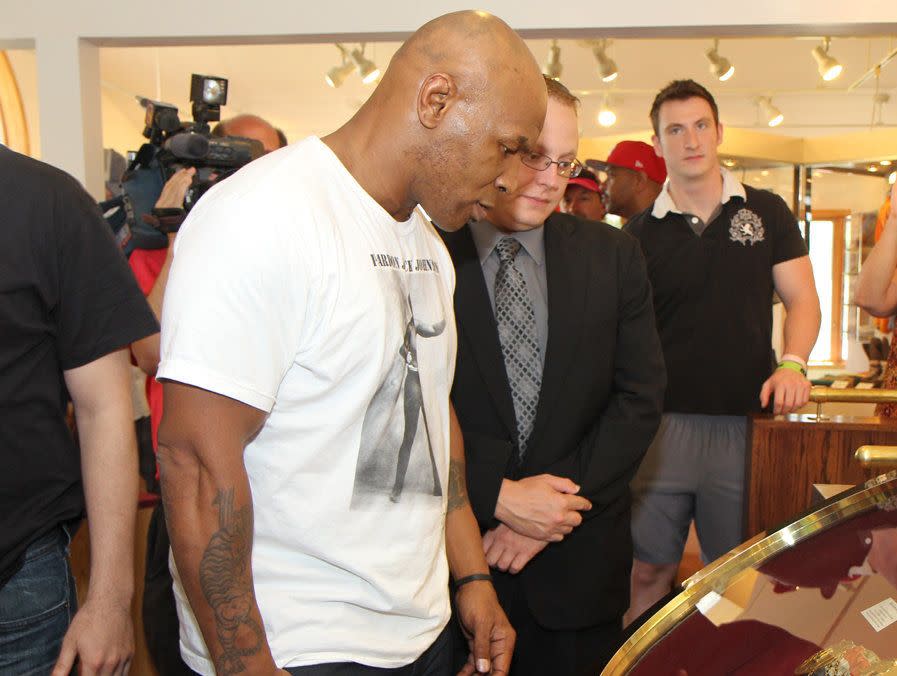 "Growing up with Cus D’amato was not only an education in how to box but also an education in the history of boxing," said Mike Tyson, pictured here at the International Boxing Hall of Fame. "Cus adored all fighters, especially the champions of the past. I became enamored with them also. I read and reread the old Ring Record books. But, what made the fighters come alive, was the fight film library of Cus’ friends, Jim Jacobs and Bill Cayton. I got to see the fights of Carmen Basilio and Tony Zale. Both Zale and Basilio were gladiators in the ring. I never saw them take a backward step. And I will never forget the super fights they had; Zale’s battles with Rocky Graziano and Basilio’s wars with the legendary Sugar Ray Robinson. Outdoors in baseball parks, standing room only, under the lights. Damn, I would have loved to have been at ringside at just one of those epics. Listening to ring announcer Johnny Addie, in his famous voice, 'And the new middle champion of the world...' Champions like Basilio, Zale, Graziano, Robinson, Dempsey, Louis, Marciano, Ali, and other legends kept me fired up and inspired me to keep training."