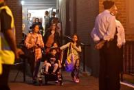 Residents are evacuated from the Taplow Tower residential block as a precautionary measure following concerns over the type of cladding used on the outside of the building on the Chalcots Estate in north London, Britain, June 23, 2017. REUTERS/Hannah McKay