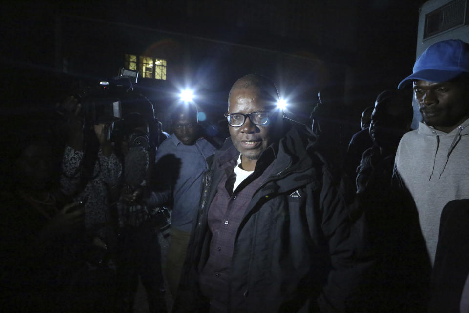 Zimbabwean opposition official TendaI Biti leaves the magistrates courts after been granted bail in Harare, Thursday, Aug, 9, 2018. Biti was charged with inciting public violence and declaring unofficial results as fears grow about a government crackdown following the disputed July 30 election, raising concerns about a wave of repression against the opposition by the government of Zimbabwe's President Emmerson Mnangagwa.(AP Photo/Tsvangirayi Mukwazhi)