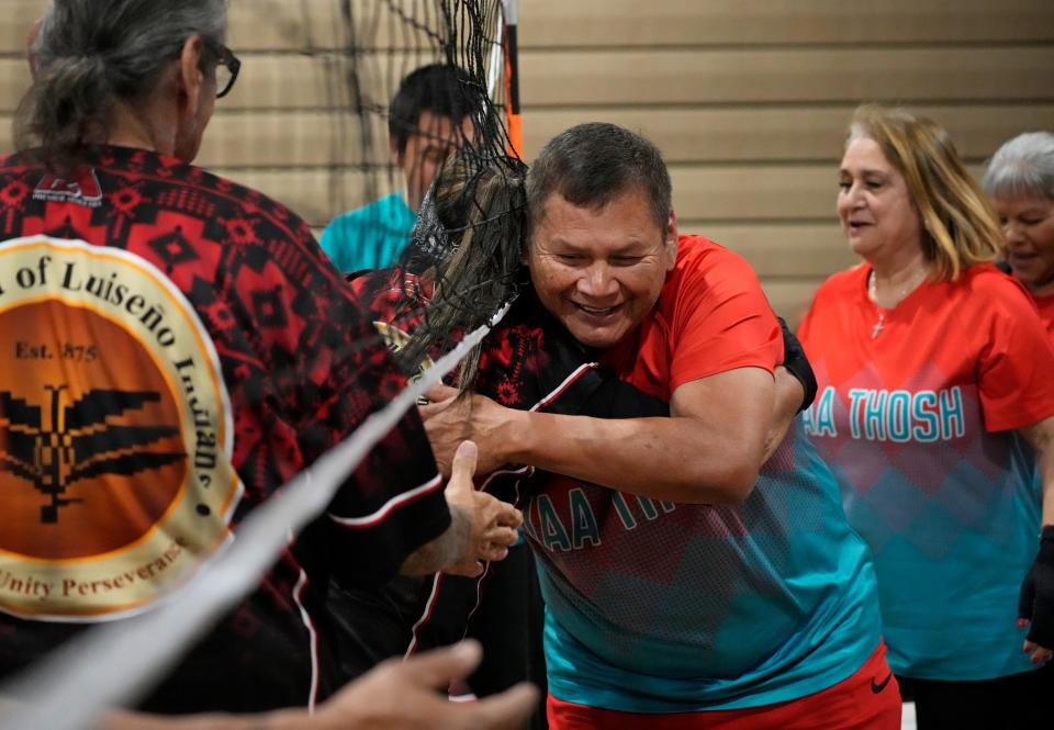 Brian Smith, chair volleyball player for Nyaa Thosh, celebrates their win over Puy Puma during a tournament at the Salt River Community Building on April 26, 2024, in Scottsdale.