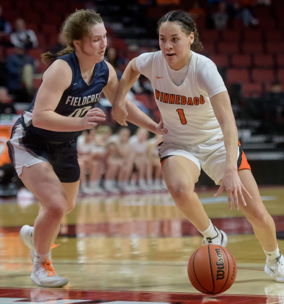 Winnebago's Miyah Brown, right, moves the ball against Fieldcrest's Carolyn Megow in the second half of the Class 2A state semifinals Thursday, March 3, 2022 at Redbird Arena in Normal. Fieldcrest fell to Winnebago 51-47.