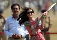 <p>Former Indian cricketer Dilip Vengsarkar looks on as Catherine, Duchess of Cambridge (R) and Britain’s Prince William, Duke of Cambridge play a game of cricket with Indian children who are beneficiaries of NGO’s at The Oval Maidan in Mumbai on April 10, 2016. </p>