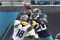 Pittsburgh Steelers wide receiver Diontae Johnson (18) can't make the catch as Jacksonville Jaguars safety Daniel Thomas (20) defends during the first half of an NFL football game, Sunday, Nov. 22, 2020, in Jacksonville, Fla. (AP Photo/Phelan M. Ebenhack)