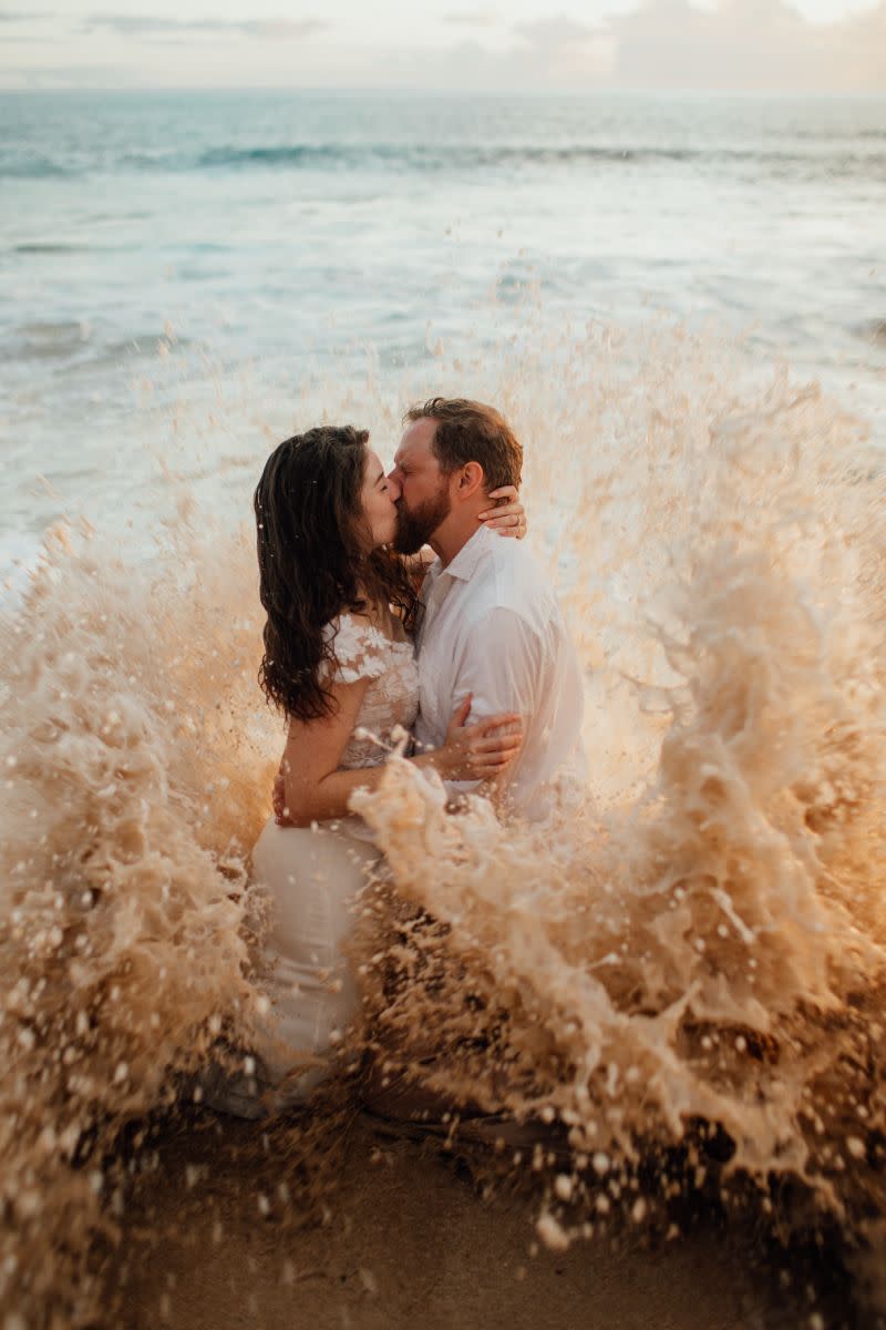 An American couple had a unique wedding photoshoot when they were hit with a rogue wave. Photo: Sunny Golden