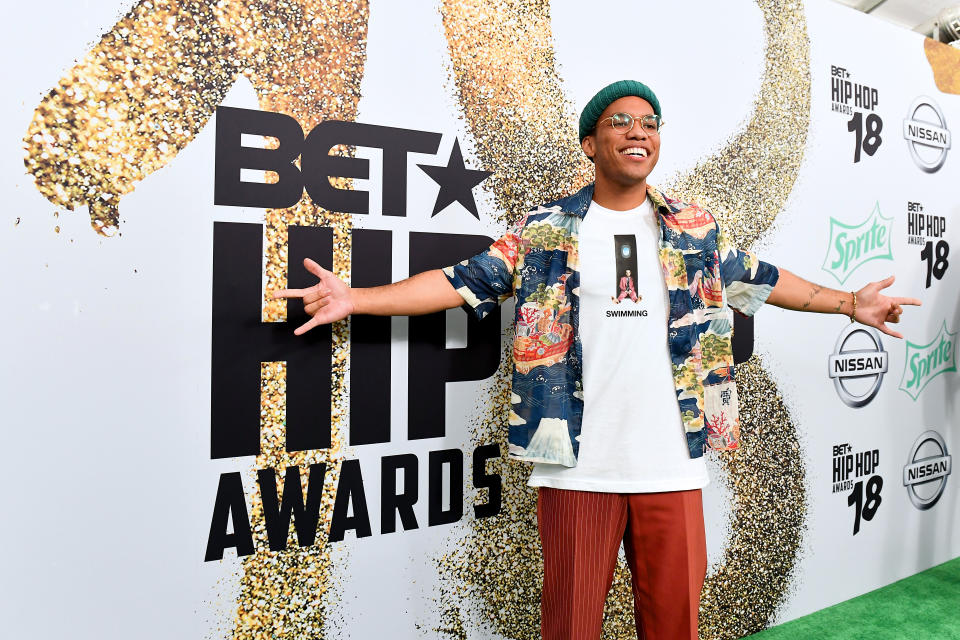 Anderson .Paak wearing Mac Miller shirt on red carpet.