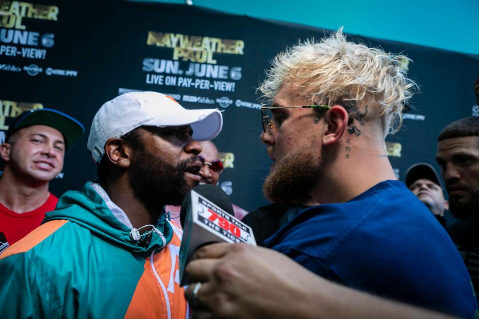 <p>Mayweather and Jake Paul face off</p> (AFP via Getty Images)