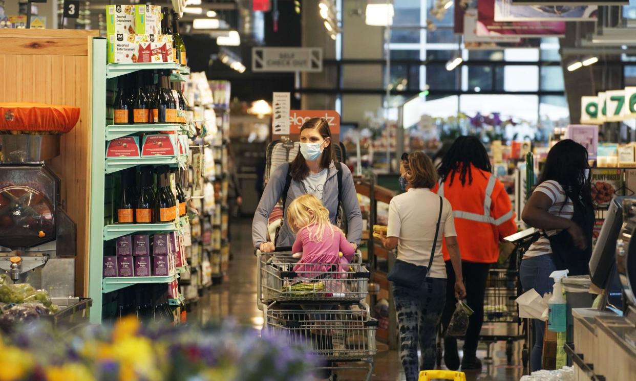 <span>People shop in a grocery store in Washington DC.</span><span>Photograph: Xinhua/REX/Shutterstock</span>