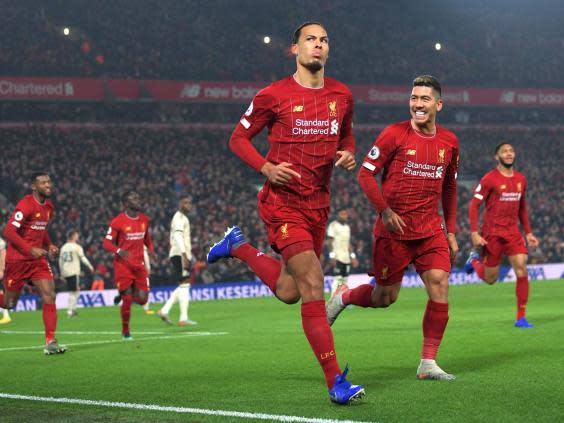 Virgil van Dijk of Liverpool celebrates with Roberto Firmino (Getty Images)