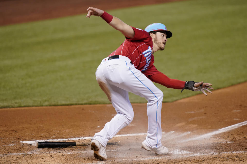 Miami Marlins' Brian Anderson scores on a single by Cody Poteet during the second inning of a baseball game against the New York Mets, Sunday, May 23, 2021, in Miami. (AP Photo/Lynne Sladky)