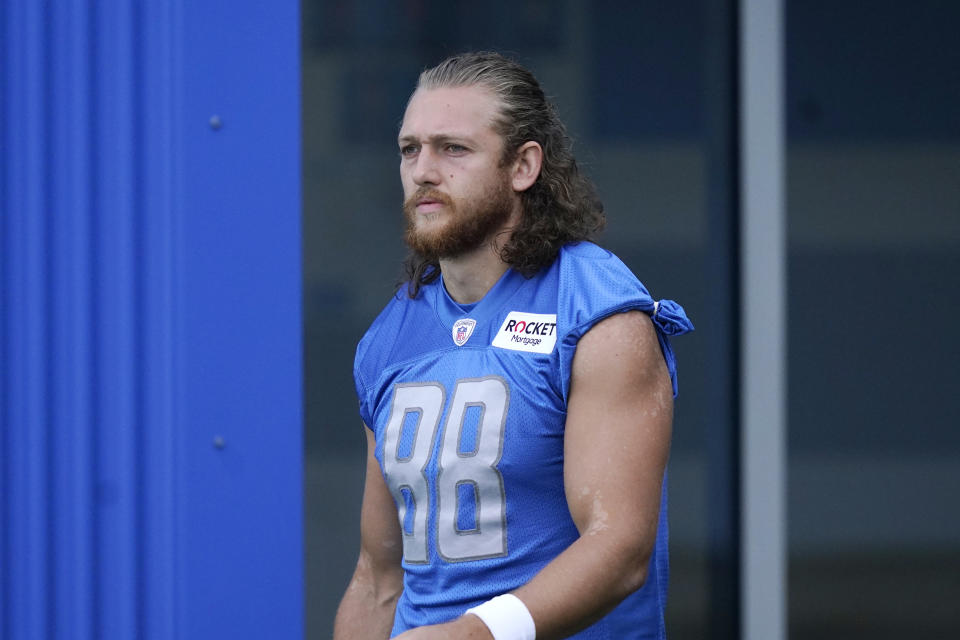 Detroit Lions tight end T.J. Hockenson walks to the field before drills at the Lions NFL football camp practice, Wednesday, July 28, 2021, in Allen Park, Mich. (AP Photo/Carlos Osorio)