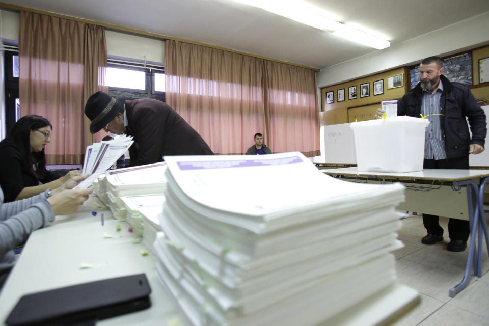 Bosnian man cast his vote at poling station in Sarajevo, Bosnia, on Sunday, Oct. 7, 2018. Bosnia is voting Sunday in a general election that could install a pro-Russian nationalist to a top post and cement ethnic divisions drawn in a brutal war more than 20 years ago. The ballot is seen as a test of whether Bosnia will move toward integration in the European Union and NATO or remain entrenched in rivalries stemming from the 1992-95 conflict.(AP Photo/Amel Emric)