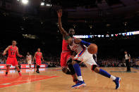 NEW YORK, NY - APRIL 08: Carmelo Anthony #7 of the New York Knicks (R) drives past Luol Deng #9 of the Chicago Bulls (L) at Madison Square Garden on April 8, 2012 in New York City. NOTE TO USER: User expressly acknowledges and agrees that, by downloading and/or using this Photograph, user is consenting to the terms and conditions of the Getty Images License Agreement. (Photo by Chris Trotman/Getty Images)