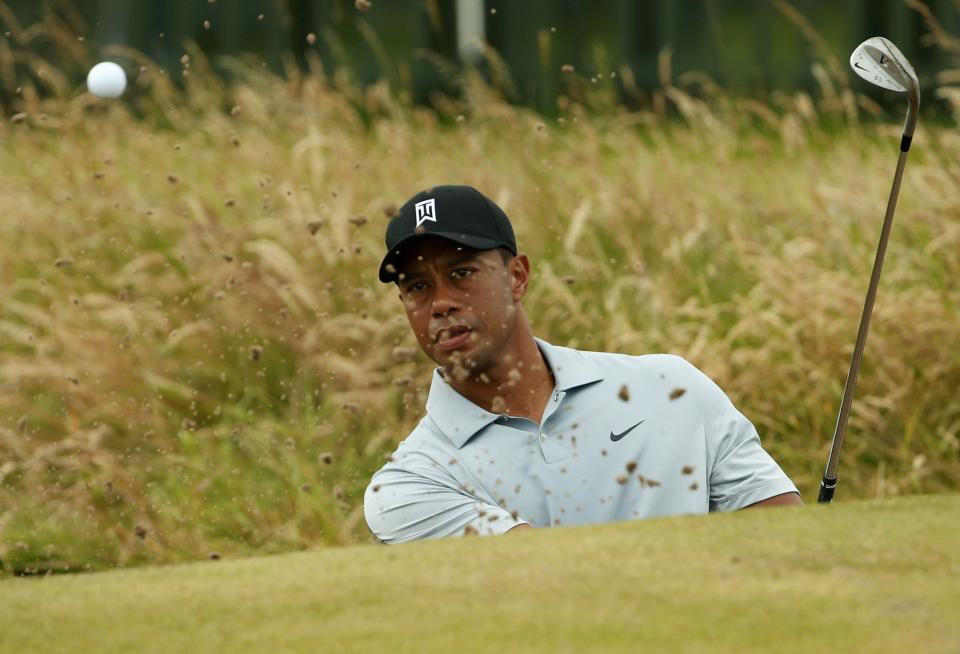 Tiger Woods of the U.S. practices on the chipping green ahead of the British Open Championship at the Royal Liverpool Golf Club in Hoylake, northern England July 16, 2014. REUTERS/Cathal McNaughton (BRITAIN - Tags: SPORT GOLF)