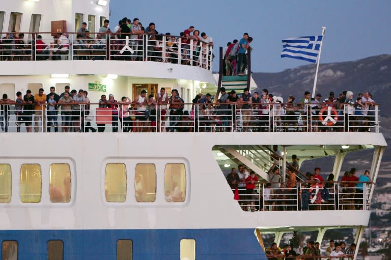 Syrian refugees aboard the Eleftherios Venizelos liner, which served as their registration and housing in the Greek port of Kos on August 18, 2015