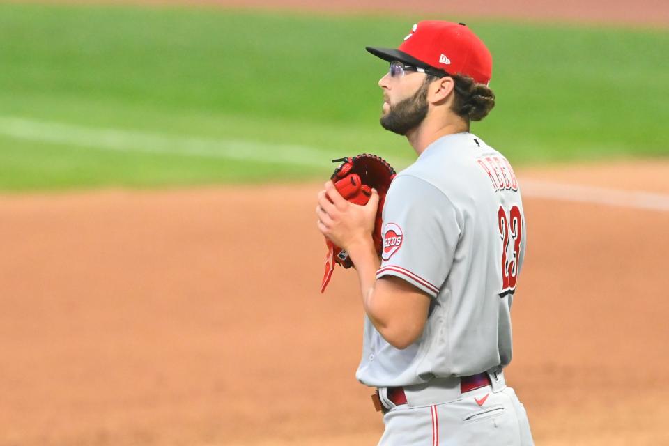 Aug 6, 2020; Cleveland, Ohio, USA; Cincinnati Reds relief pitcher Cody Reed (23) watches the ball on a two-run home run by Cleveland Indians third baseman Jose Ramirez (11), not pictured, in the seventh inning at Progressive Field. Mandatory Credit: David Richard-USA TODAY Sports