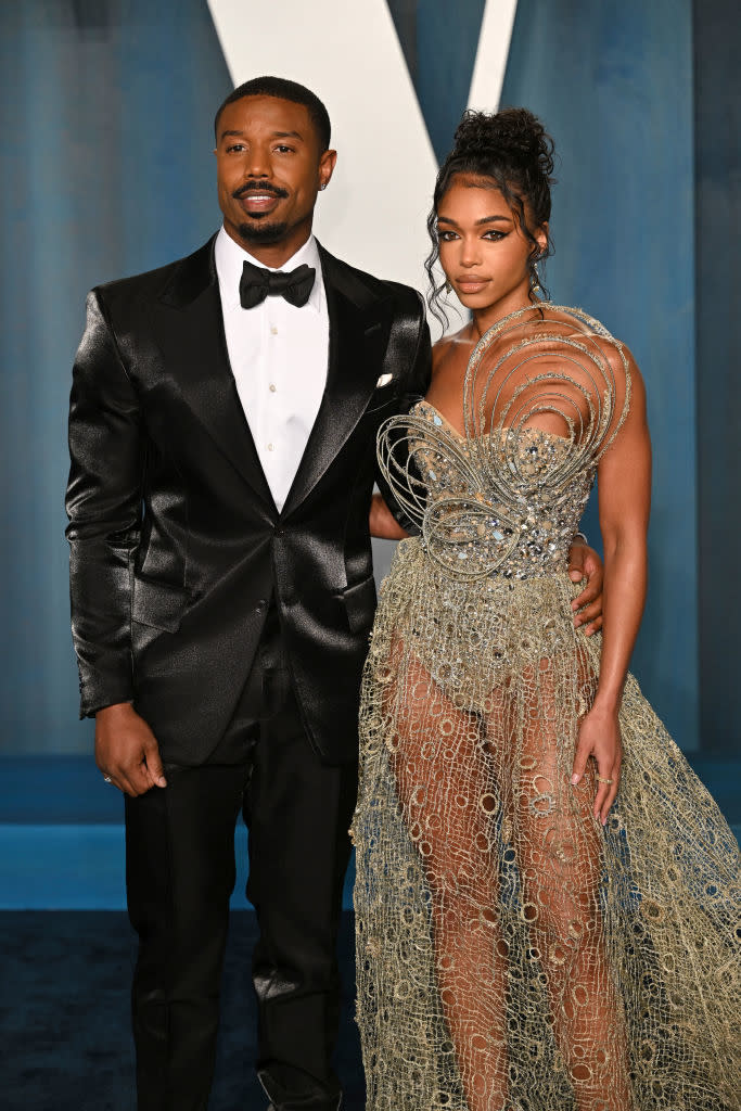 Michael in a bow tie and Lori in a see-through strapless gown