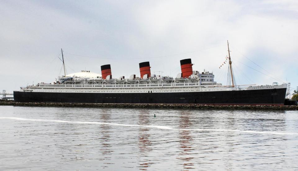 This May 15, 2015 photo shows the retired Cunard ocean liner Queen Mary, at its permanent mooring in the harbor at Long Beach, Calif. A survey has found the ship is so corroded that it's at urgent risk of flooding, and the price tag for fixing up the 1930s ocean liner could near $300 million. Documents obtained the Long Beach Press-Telegram show it would take five years to rehab the ship. Engineers who compiled the survey warn that the vessel is probably "approaching the point of no return." (AP Photo/John Antczak)