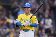 Boston Red Sox's Masataka Yoshida walks to the dug out after striking out swinging during the fifth inning of a baseball game against the Los Angeles Angels, Saturday, April 13, 2024, in Boston. (AP Photo/Michael Dwyer)