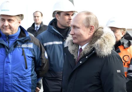 Russian President Vladimir Putin inspects the completed road section of the Crimea Bridge over the Kerch Strait, Crimea, March 14, 2018. Sputnik/Aleksey Nikolskyi/Kremlin via Reuters