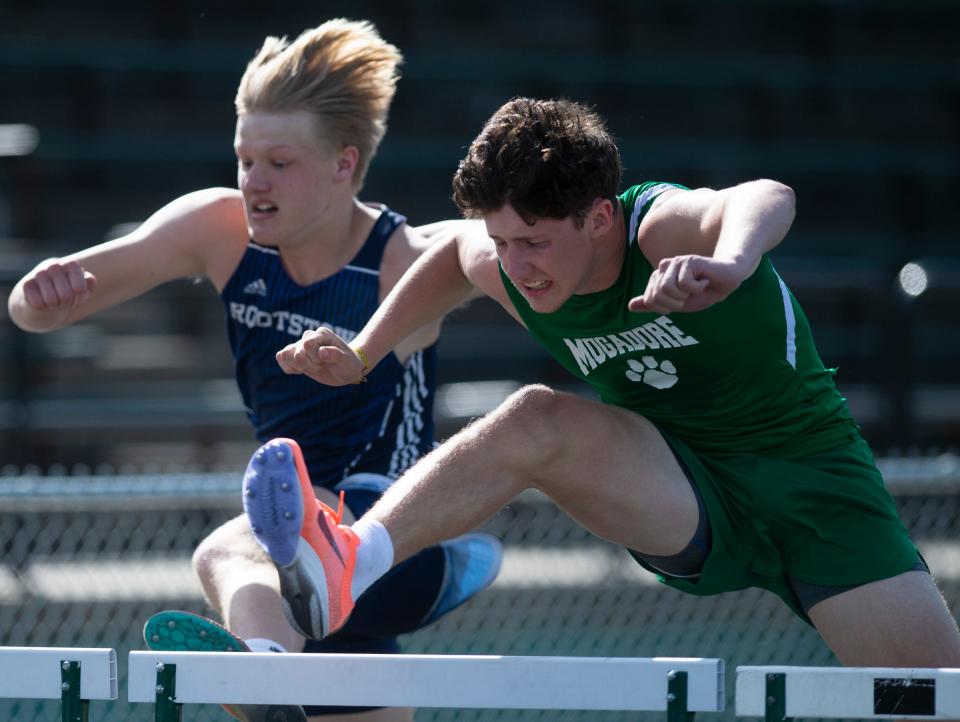 Mogadore's Mason Murphy and Rootstown's Aiden Rodstrom compete in the 110-meter hurdles at the 2022 Portage Trail Conference Championships.