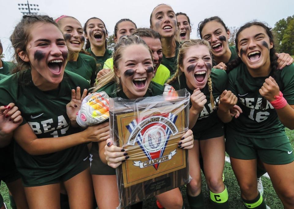 The East Brunswick girls soccer team celebrates after winning the 2022 GMCT championship