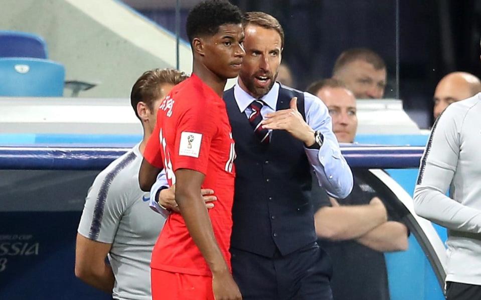 Gareth Southgate passes instructions to Marcus Rashford - PA