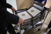 Binders bearing the names of Senators are wheeled around on Capitol Hill in Washington, Tuesday, Aug. 3, 2021. (AP Photo/Amanda Andrade-Rhoades)