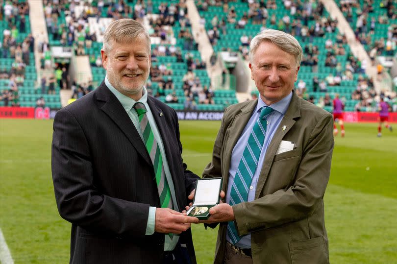 Steven Carr was presented with the award by Royal Scottish Geographical Society board member David Henry at Easter Road