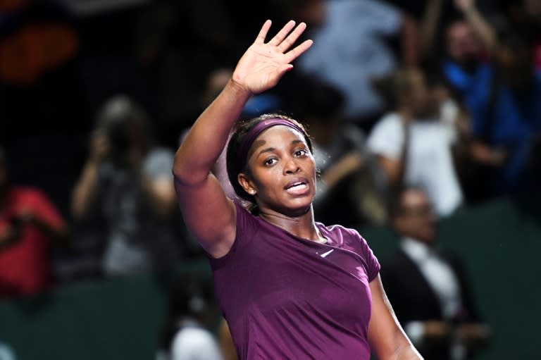 Sloane Stephens of the US celebrates after defeating Kiki Bertens of the Netherlands during their singles match at the WTA Finals tennis tournament in Singapore