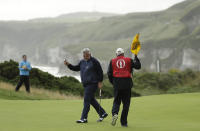 Northern Ireland's Darren Clarke acknowledges the crowd after getting a birdie on the 5th green during the first round of the British Open Golf Championships at Royal Portrush in Northern Ireland, Thursday, July 18, 2019.(AP Photo/Matt Dunham)