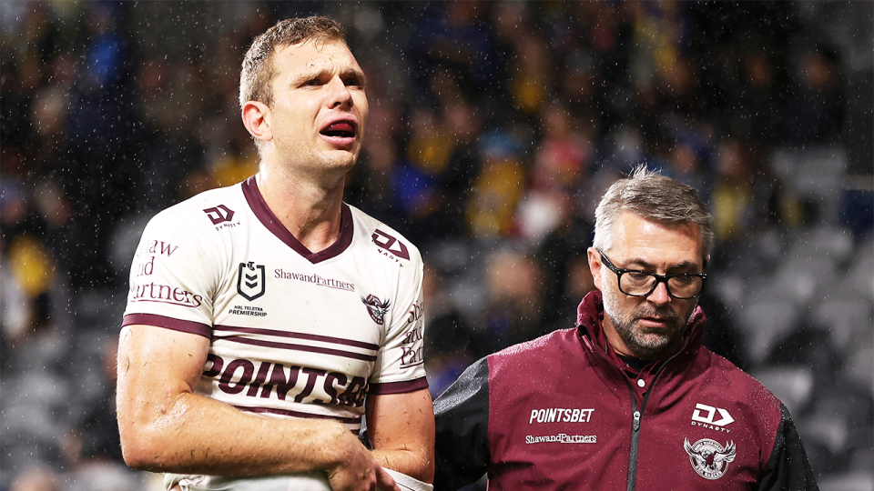 Manly's Tom Trbojevic (pictured left) leaving the field after after a shoulder injury.