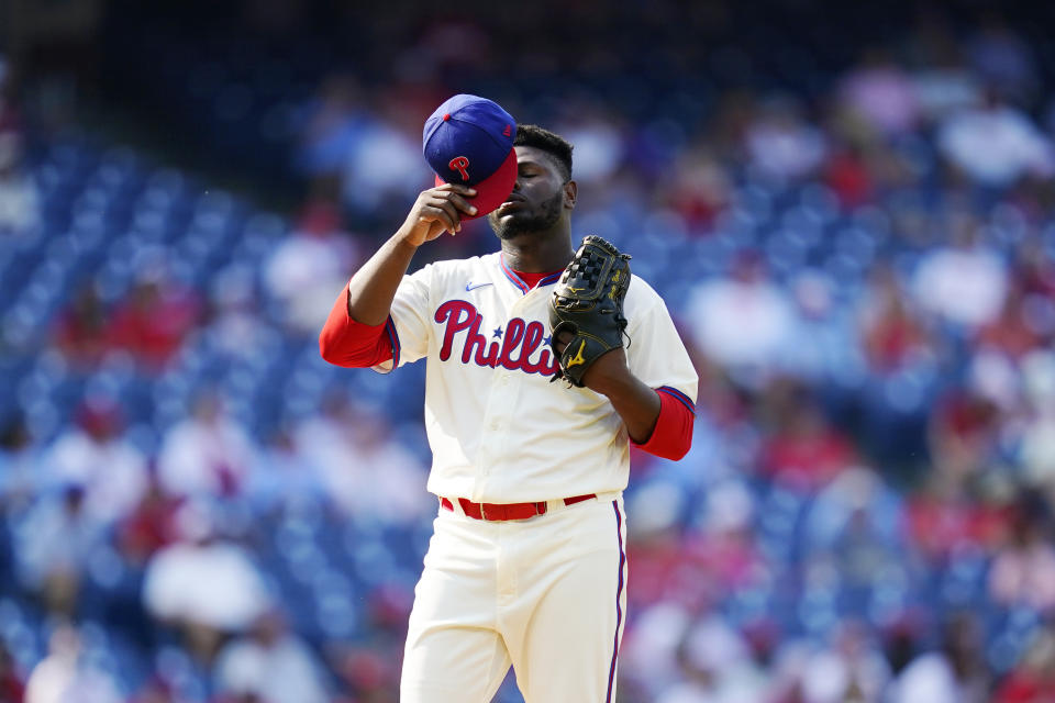 Philadelphia Phillies pitcher Hector Neris reacts after giving up a two-run home run to Colorado Rockies' Garrett Hampson during the seventh inning of a baseball game, Sunday, Sept. 12, 2021, in Philadelphia. (AP Photo/Matt Slocum)